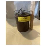Small brown crock with metal lid..   hairline