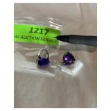 Pierced earrings with amethyst looking stone..