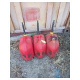 Three 5 gallon gas cans