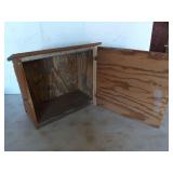 Wooden box with hinged door and slanted roof,