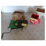 Three seed spreaders, one is green by Galvanized