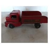 Old red metal toy truck, Structo towing service,