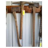 An ax, a double-headed ax, and a pickaxe which