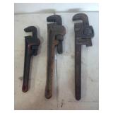 Three pipe wrenches