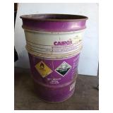 Empty purple and white Cairox 55 gallon drum