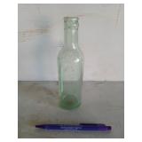 8 inch glass "Moxie" bottle