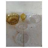 Two glass bowls, two glass plates including a