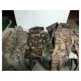 Box filled with assorted camo/hunting clothes,