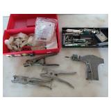 Red Plano box filled with cattle tagging