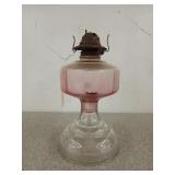 12 inch hurricane lamp with pink colored top,