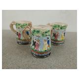 Three Majolica beer steins with people dancing
