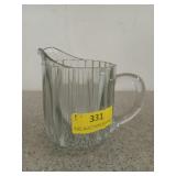 5 inch glass cream pitcher, has a chip