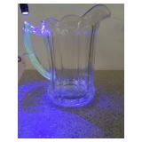 8 inch, clear glass pitcher with scalloped edge,