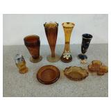 Assorted amber glass decor, including cups, and