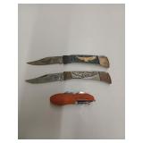Three assorted pocket knives one needs a little