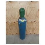 36-in blue compressed oxygen bottle, partially