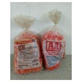 Two bags of double A red wads by Winchester, one