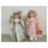 Two porcelain dolls, 16 in, pink one is a
