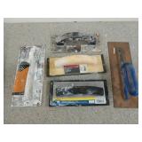 Five assorted grout floats /trowels