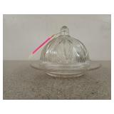 Clear glass butter / cheese dish has some chips,
