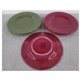 Five green and cranberry colored plates, 11 in