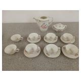Beautiful cream colored tea set with pine/flower