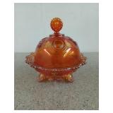 Orange carnival glass candy dish with lid, 7 in