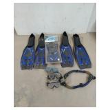 Set of three swimming slippers, three masks, and