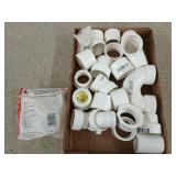Flat of assorted PVC fittings, mostly 1.5 in
