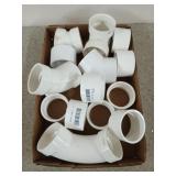 The flat of assorted 2-in PVC couplers, etc