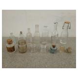 Collection of old glass bottles, assorted sizes,