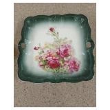 Decorative green dish with roses and green