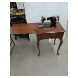 Wooden sewing machine table with old electric