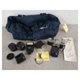 Yashica camera with lots of accessories in a