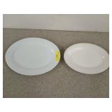 Two white platters, the largest is 14x10 in