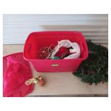 Red storage tote filled with Christmas