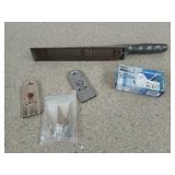 Assorted tools, including a 10-in rasp, a new