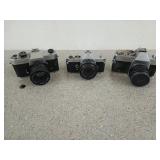 Three old cameras, one is Yashica, one is