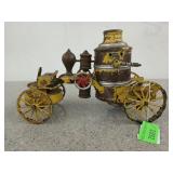 Antique metal wind up fire pumper with bell,