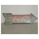 Coca-Cola arrow sign with cracked paint, 9x28 in
