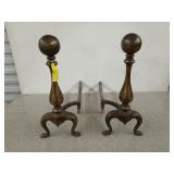 Pair of brass and iron, cannonball fireplace