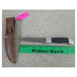 Remington fixed knife blade with leather sheath,