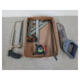 Assorted tools, includes saws, squares, and a