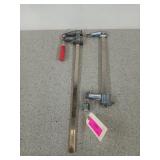 Two metal furniture clamps, one is a Bessey, 12