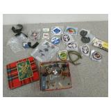 Cookie tin filled with assorted patches, some