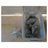 Silver storage tub filled with Christmas decor,