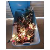 Blue storage tub filled with red white and green