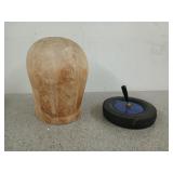 An old wooden mannequin head, and a BF Goodrich