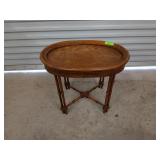 Wood oval side table with bamboo-styled legs,