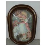 Old wooden bubble glass frame with artwork,